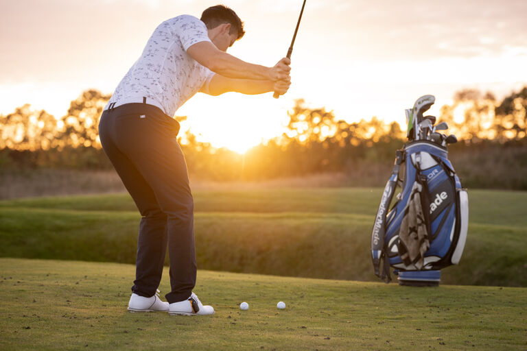 player-tensing-muscles-in-backswing